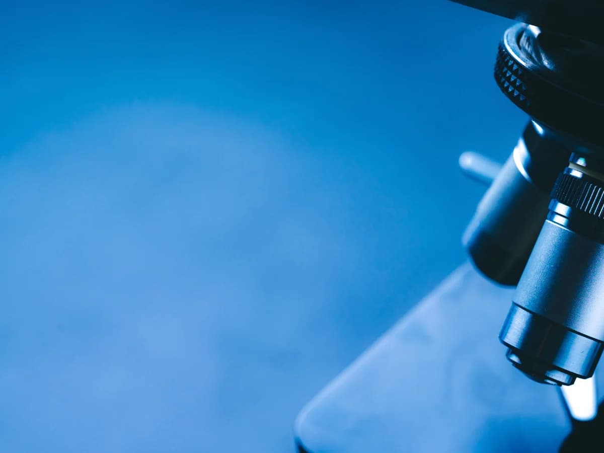 Close-up of a microscope illustrating scientific research.